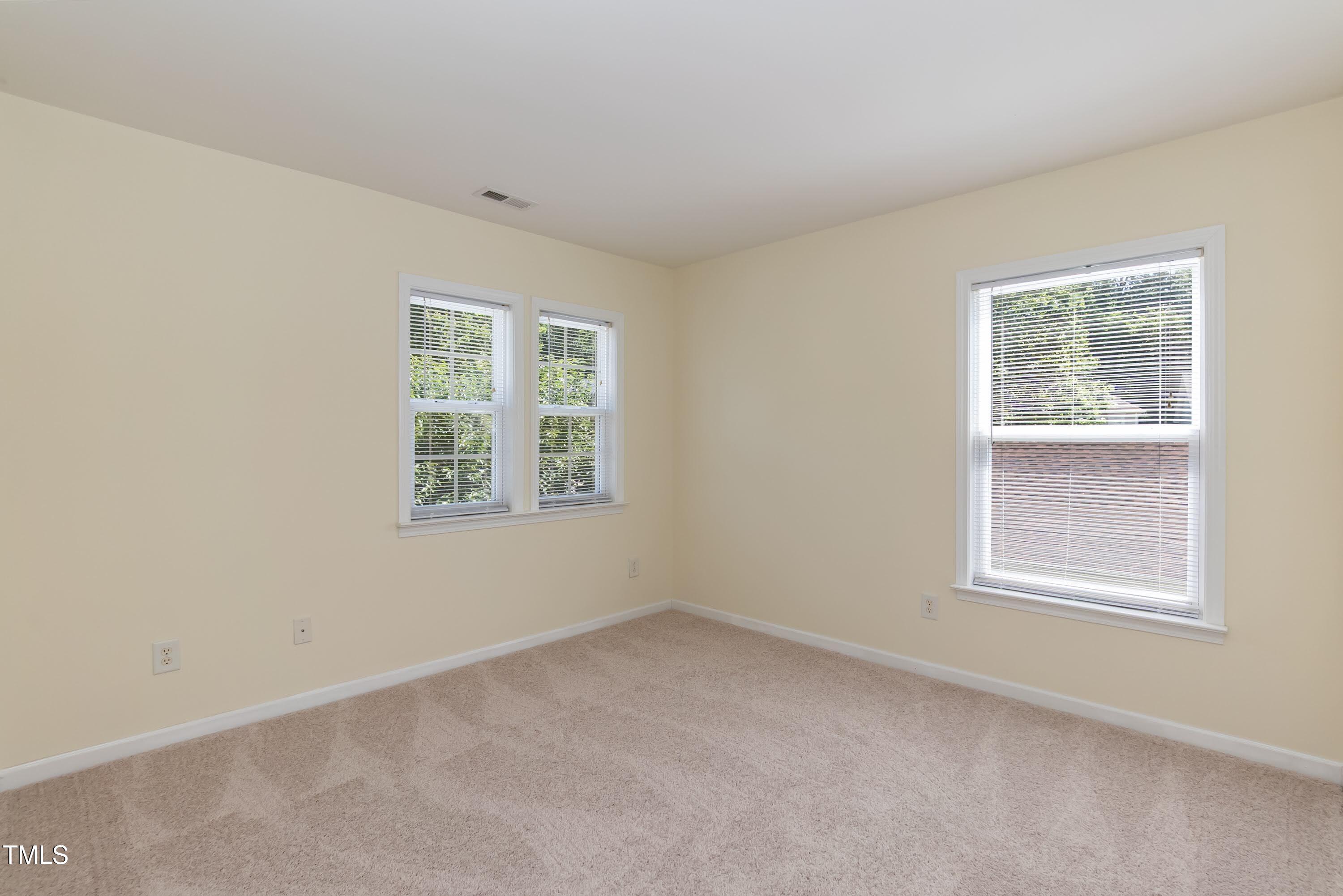 418 Byrams Ford Drive Cary, NC 27513 - Photo 28 of 53 an empty room with windows