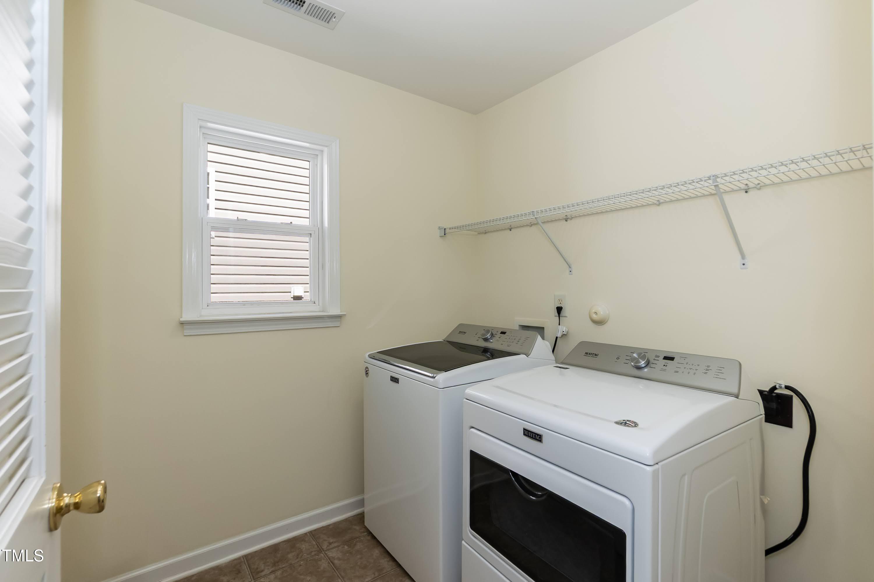 418 Byrams Ford Drive Cary, NC 27513 - Photo 32 of 53 a utility room with dryer and washer