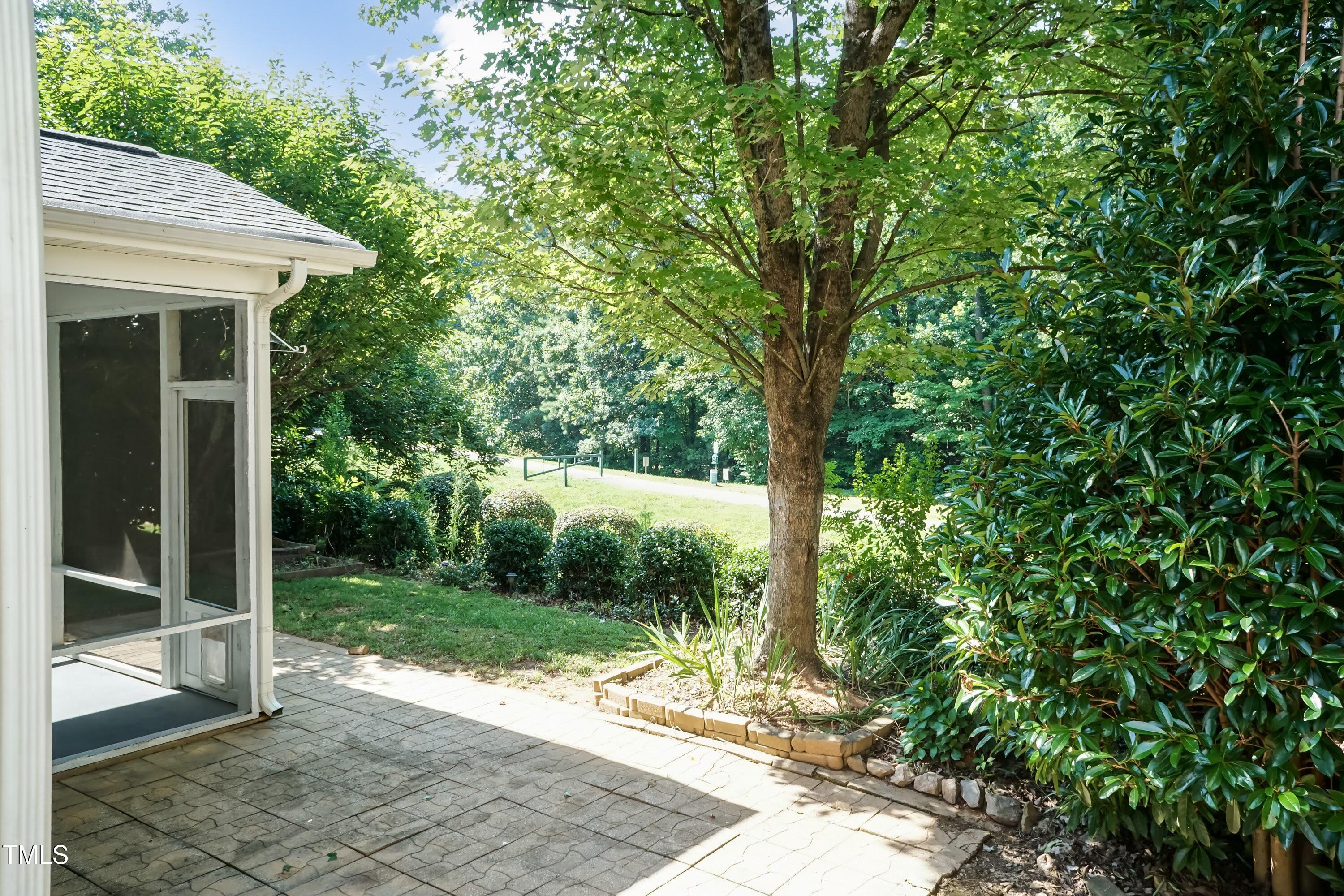 418 Byrams Ford Drive Cary, NC 27513 - Photo 38 of 53 a view of a backyard with garden
