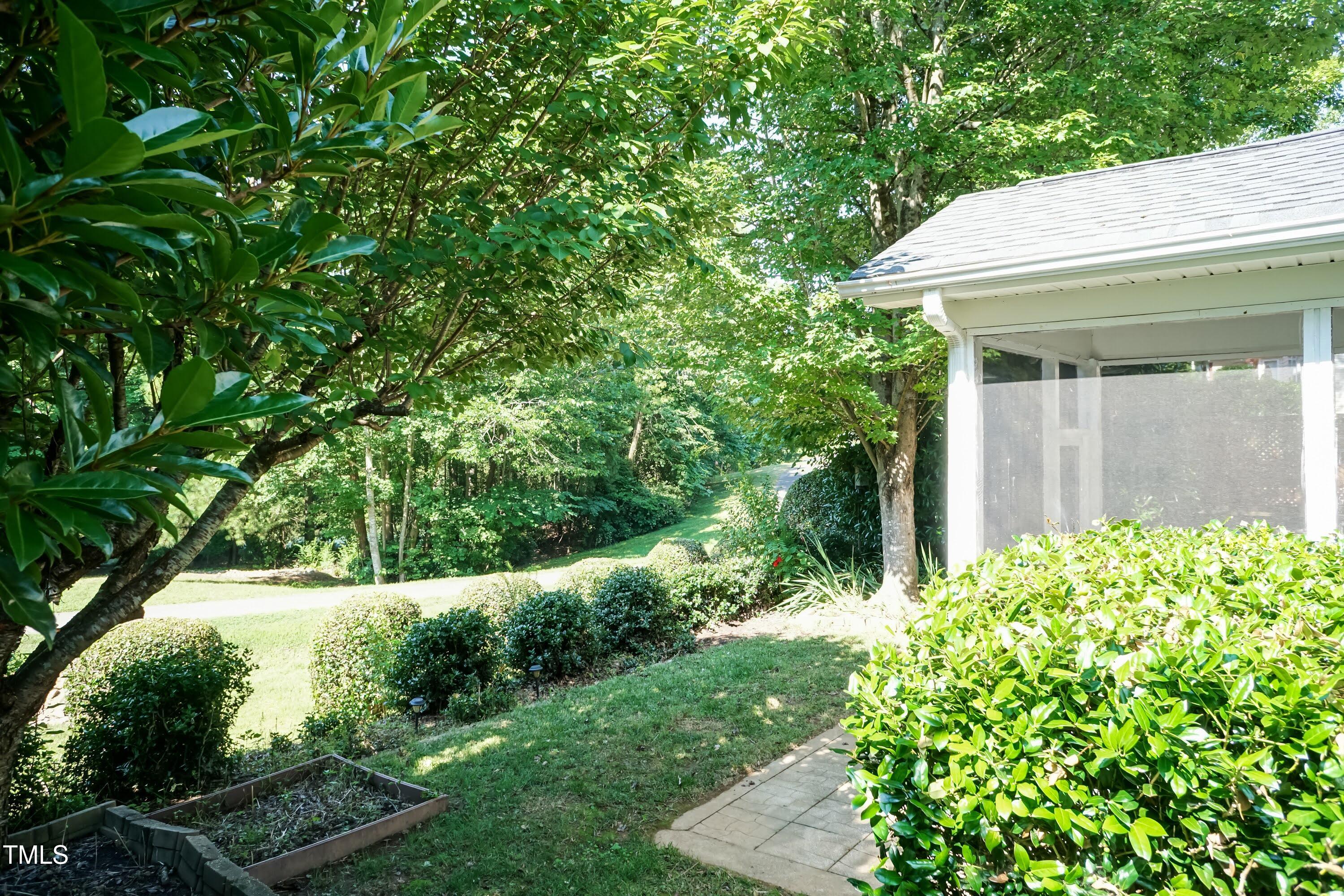 418 Byrams Ford Drive Cary, NC 27513 - Photo 39 of 53 a yellow house with lots of green space