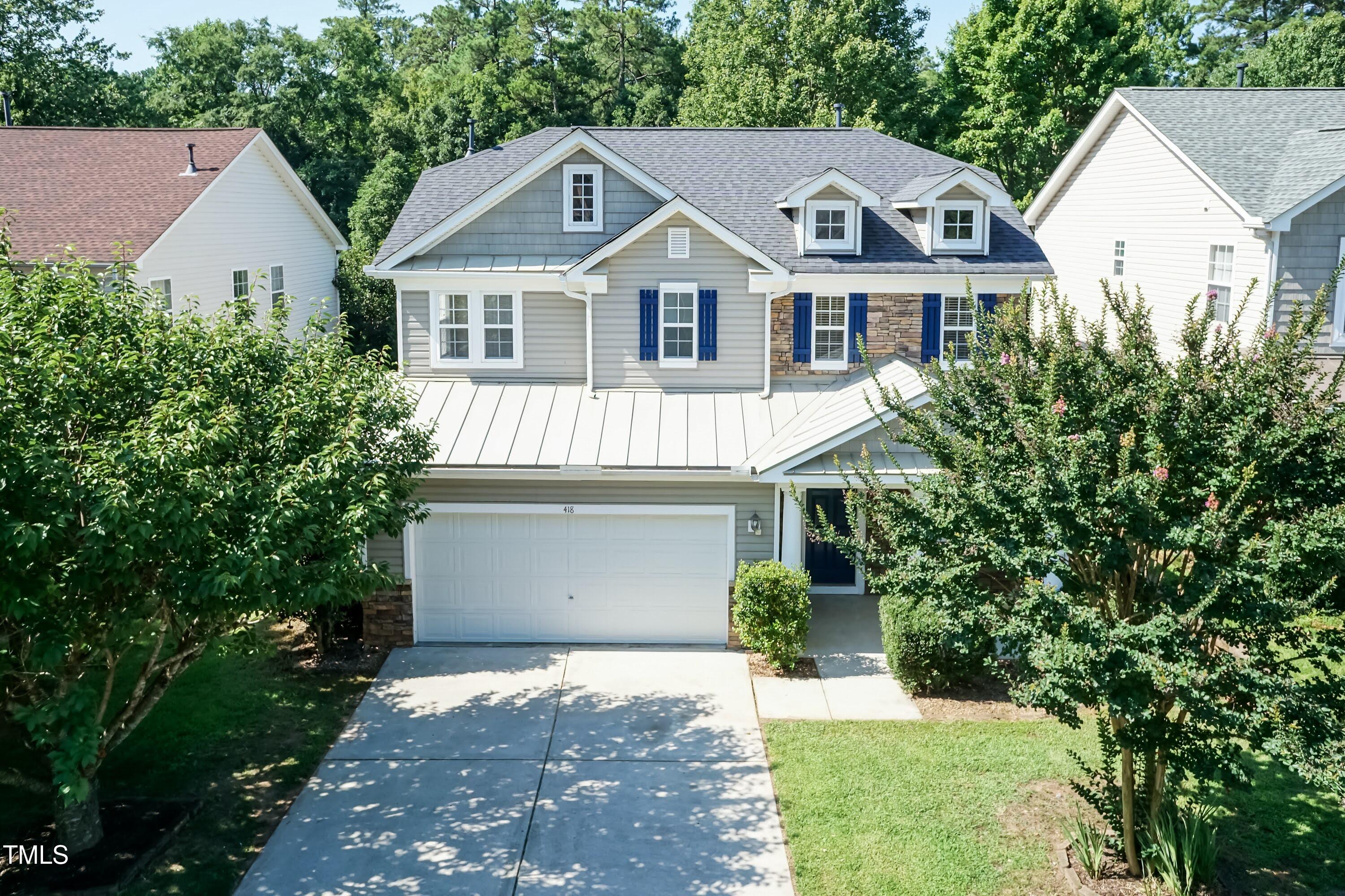 418 Byrams Ford Drive Cary, NC 27513 - Photo 46 of 53 a view of a house with a yard and potted plants