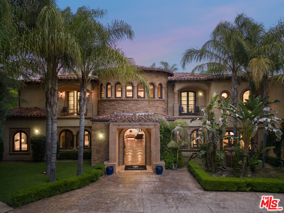 18607 Cassandra Street Tarzana, CA 91356 - Photo 11 of 58 a front view of a house with a garden