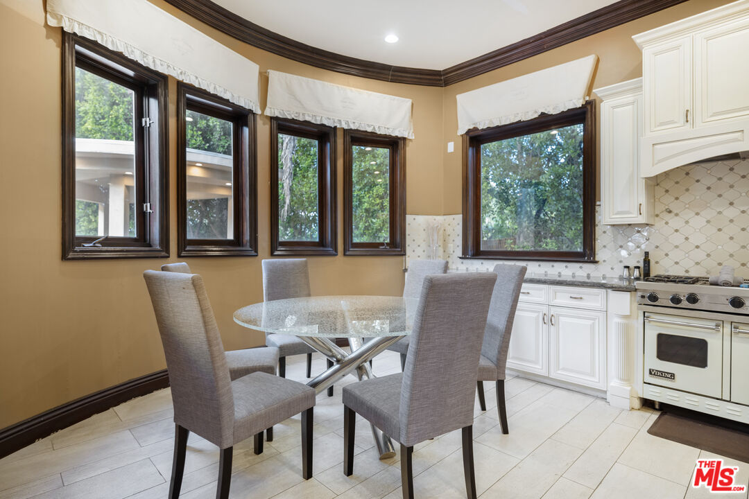 18607 Cassandra Street Tarzana, CA 91356 - Photo 20 of 58 a view of a dining room with furniture window and outside view