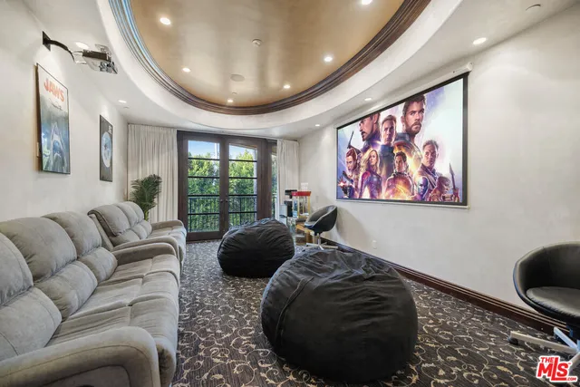 a living room with a couch and wooden floor