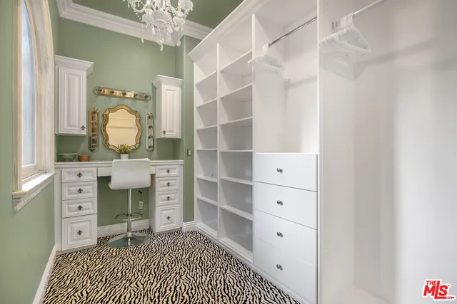 a bathroom with a granite countertop toilet sink and mirror