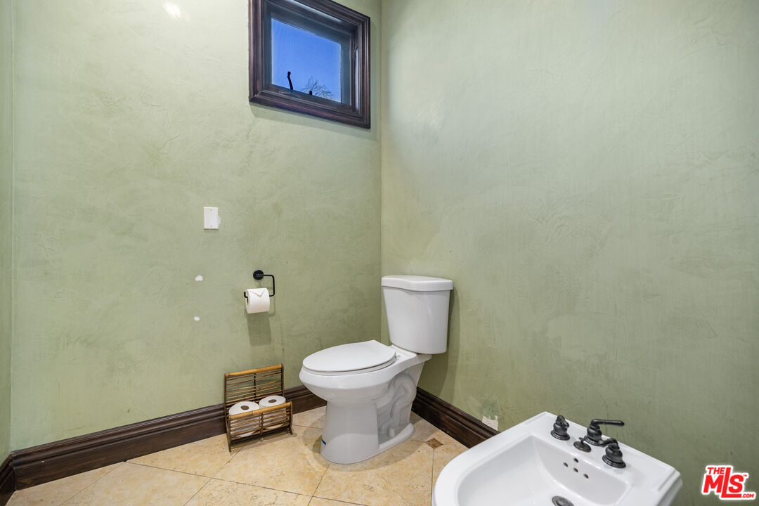 18607 Cassandra Street Tarzana, CA 91356 - Photo 37 of 58 a bathroom with a toilet and a sink