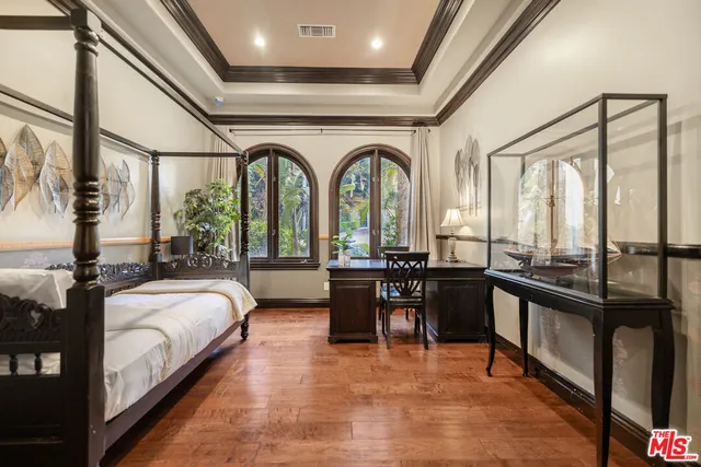 a view of a swimming pool with chairs and tables