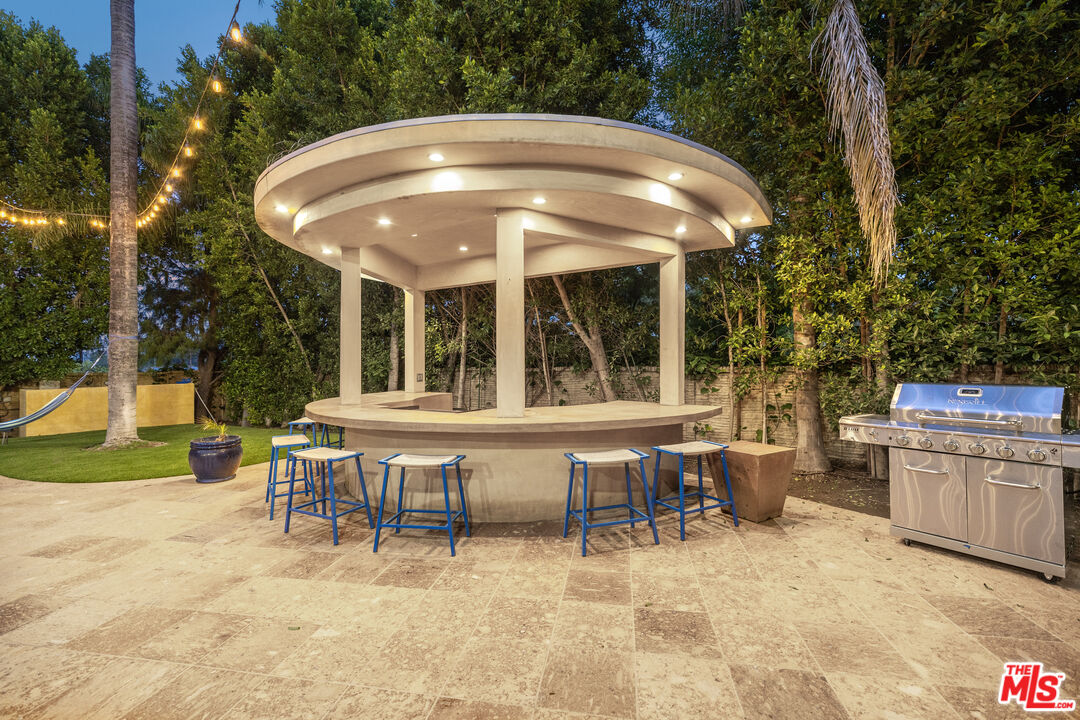 18607 Cassandra Street Tarzana, CA 91356 - Photo 50 of 58 a view of a chairs and table in the patio