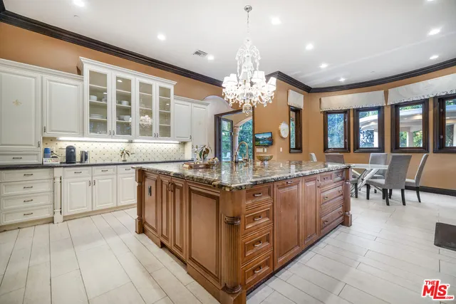 a view of a patio with dining table and chairs