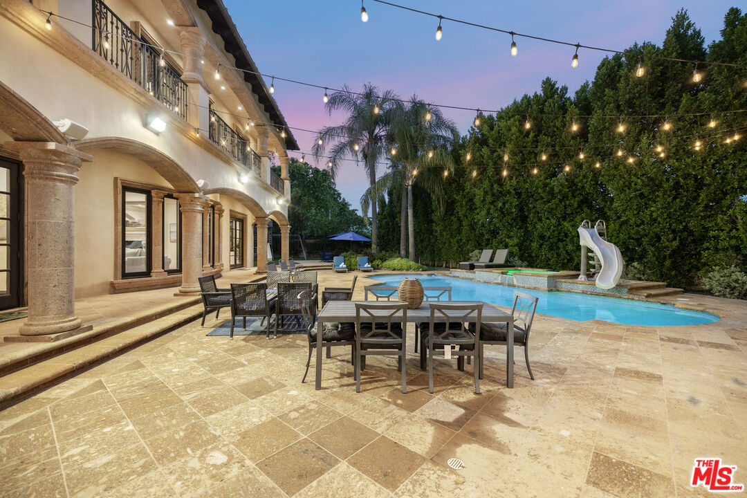 18607 Cassandra Street Tarzana, CA 91356 - Photo 54 of 58 a view of a patio with a table and chairs