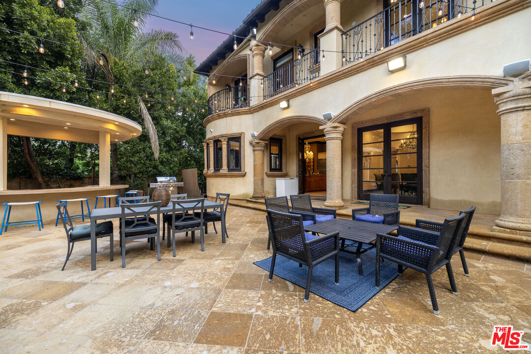 18607 Cassandra Street Tarzana, CA 91356 - Photo 7 of 58 a view of a patio with dining table and chairs
