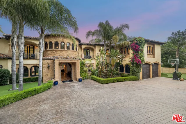 a view of a house with a snow in the yard