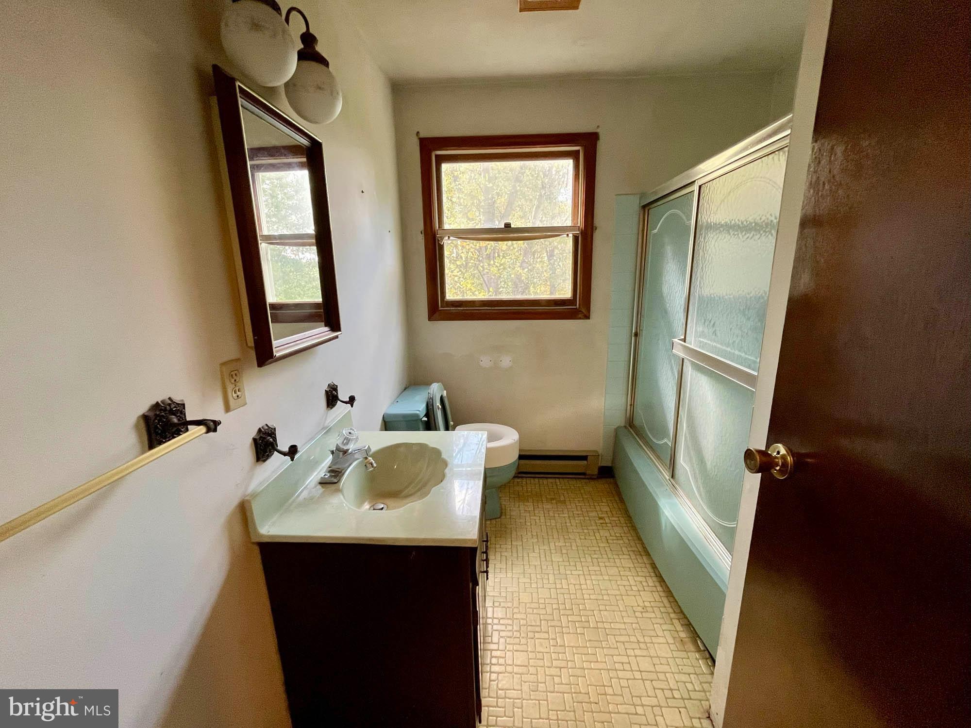 4992 Millers Station Road Hampstead, MD 21074 - Photo 16 of 24 a bathroom with a sink toilet and tub
