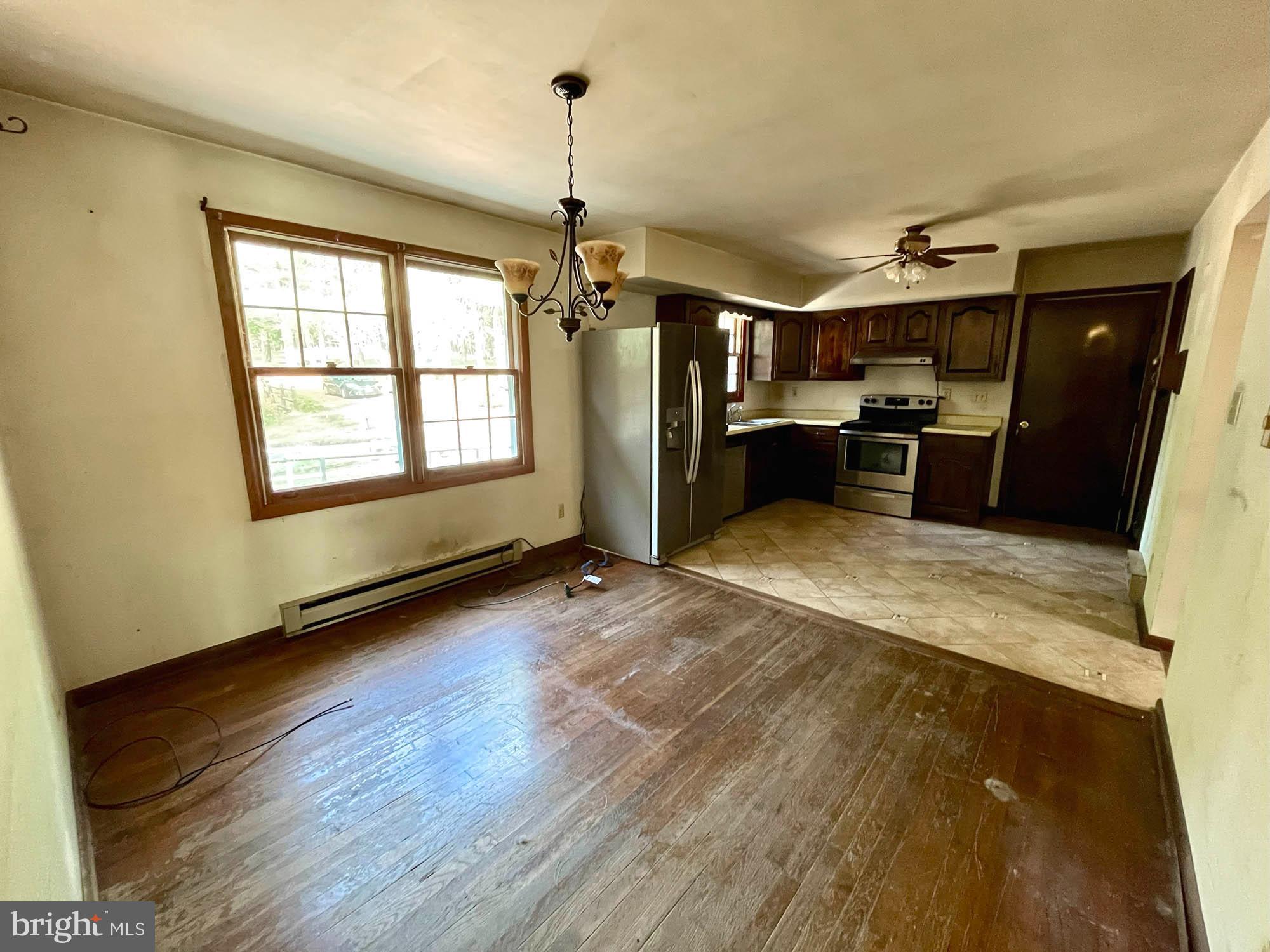 4992 Millers Station Road Hampstead, MD 21074 - Photo 8 of 24 a view of a room window and wooden floor