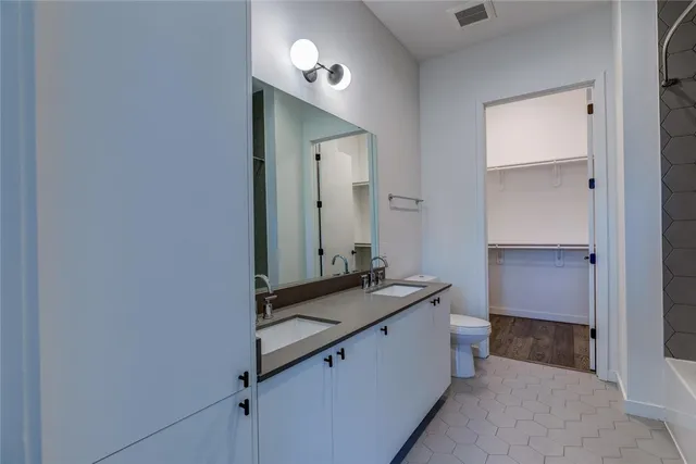 a room with a mirror and a sink