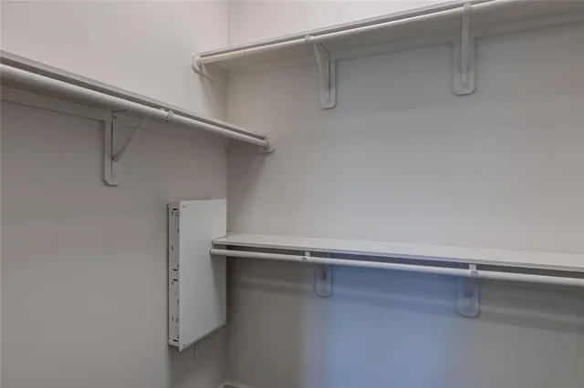 a kitchen with granite countertop a stove and a microwave