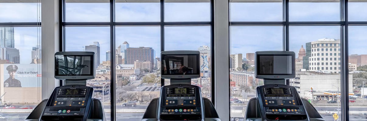 800 Embassy Drive, Unit 233 Austin, TX 78702 - Photo 30 of 40 a view of a hallway with windows and refrigerator