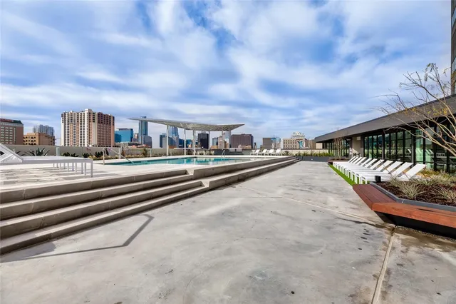 a view of a terrace with a table and chairs