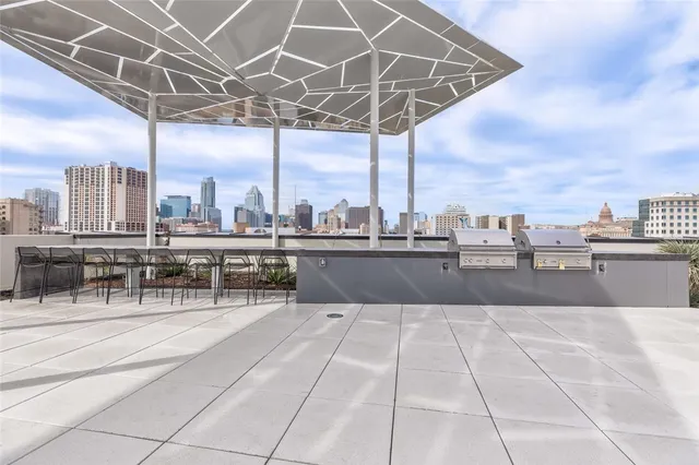 a kitchen with a dining table chairs and white cabinets