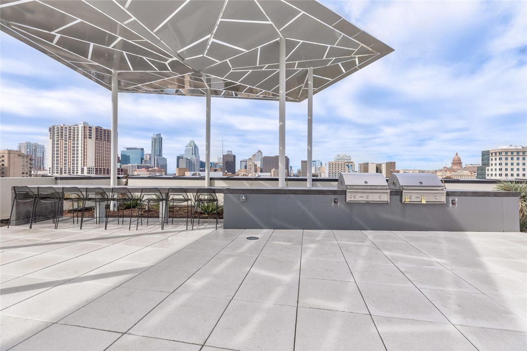 800 Embassy Drive, Unit 233 Austin, TX 78702 - Photo 35 of 40 a view of a terrace with a table and chairs