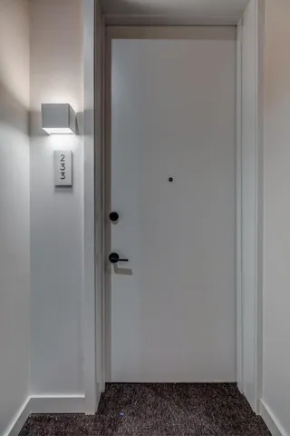 a kitchen with stainless steel appliances granite countertop a kitchen island hardwood floor sink and stove