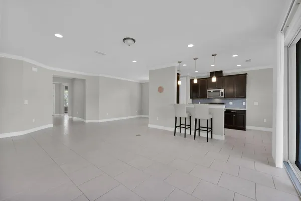 a view of kitchen with cabinets and wooden floor
