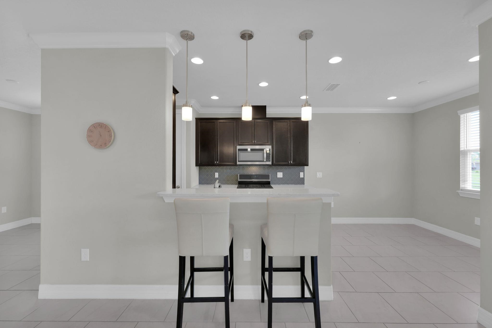 164 Front Door Lane St. Augustine, FL 32095 - Photo 15 of 42 a view of kitchen with cabinets and wooden floor