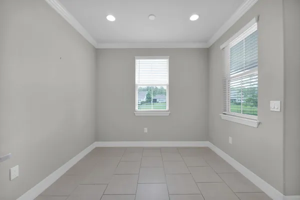 a large kitchen with stainless steel appliances kitchen island granite countertop a refrigerator and a stove top oven