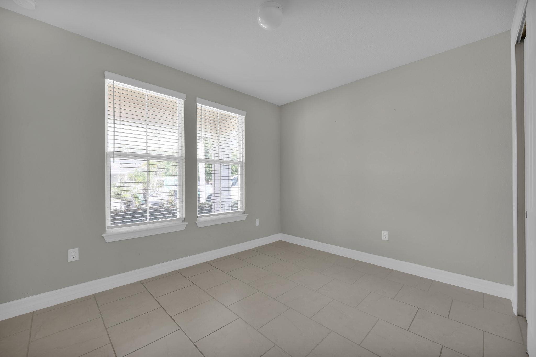 164 Front Door Lane St. Augustine, FL 32095 - Photo 21 of 42 an empty room with a window