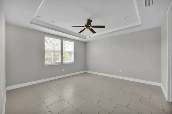 a bathroom with a double vanity sink a mirror and a shower
