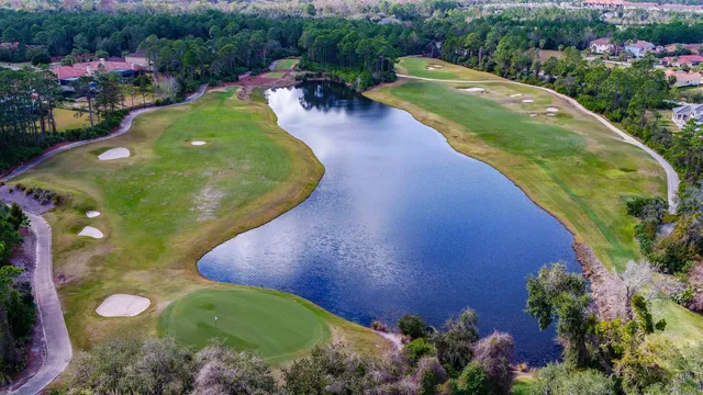 an aerial view of a house with a swimming pool yard and outdoor seating