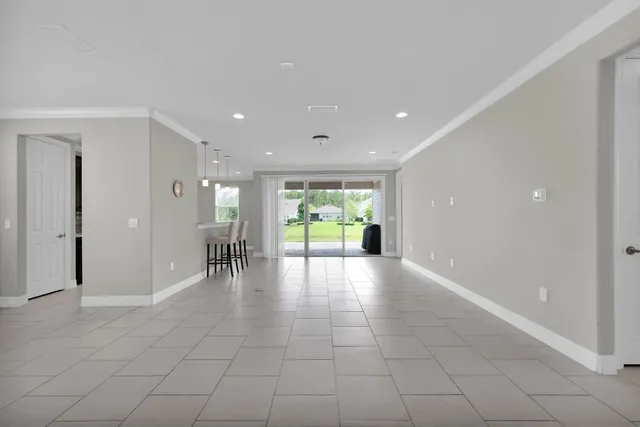 a view of a hallway with a bathroom