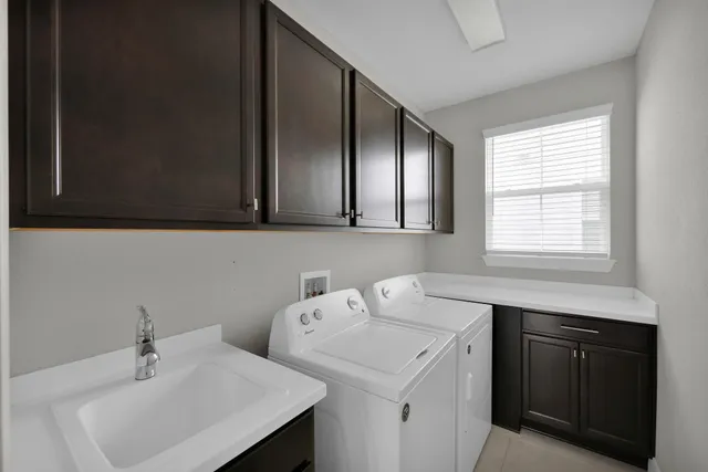 a kitchen with kitchen island stainless steel appliances a sink stove and cabinets