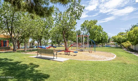 a view of a hallway with wooden shelves