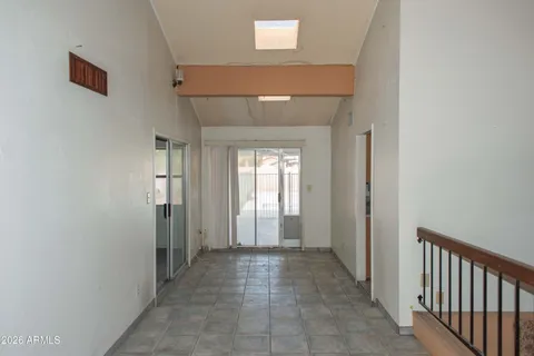 a kitchen with stainless steel appliances granite countertop a sink and a stove