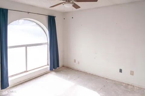 a view of staircase with white walls