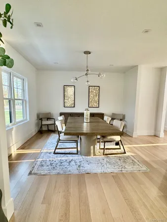 a bathroom with a granite countertop sink a mirror and a bathtub