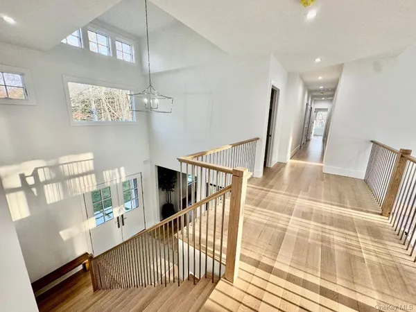 a view of a house with backyard and a tree