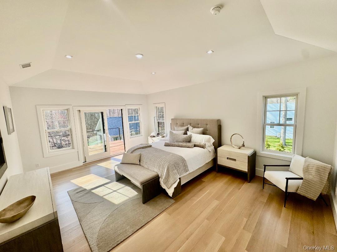 69 Jagger Lane Westhampton, NY 11977 - Photo 32 of 50 Primary bedroom with 2 walk in closets, master bath & Ipe deck.