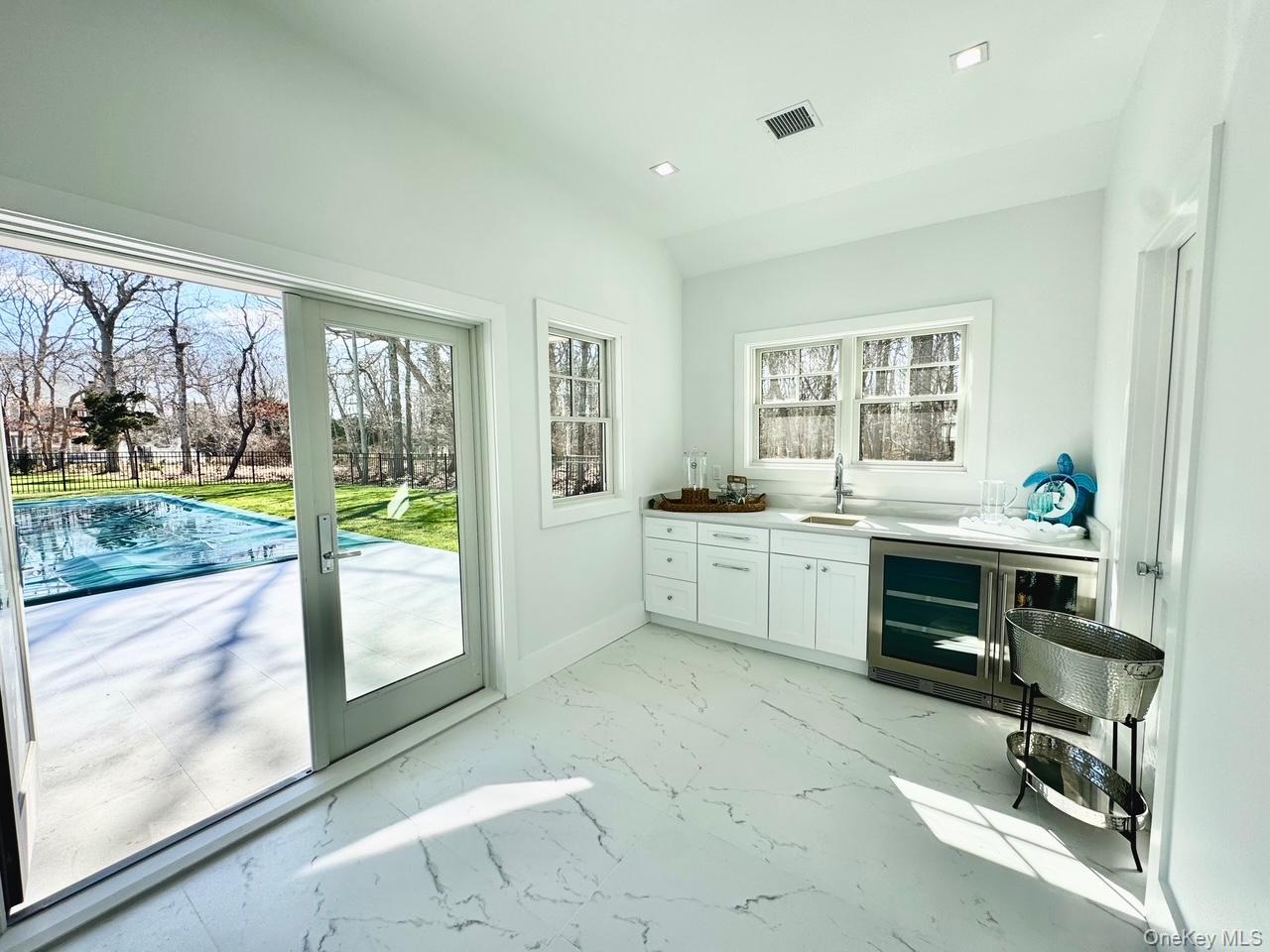 69 Jagger Lane Westhampton, NY 11977 - Photo 49 of 50 Pool house with wet bar, full bath and storage room for pool items.