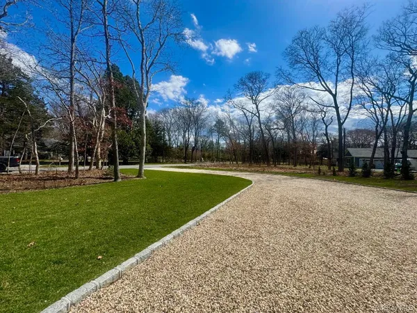 a view of livingroom with furniture wooden floor and windows