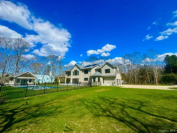 a view of living room with furniture and floor to ceiling window