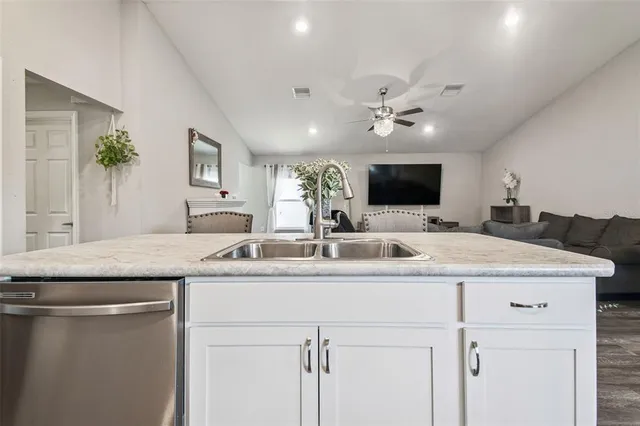 a bedroom with a bed window and couch