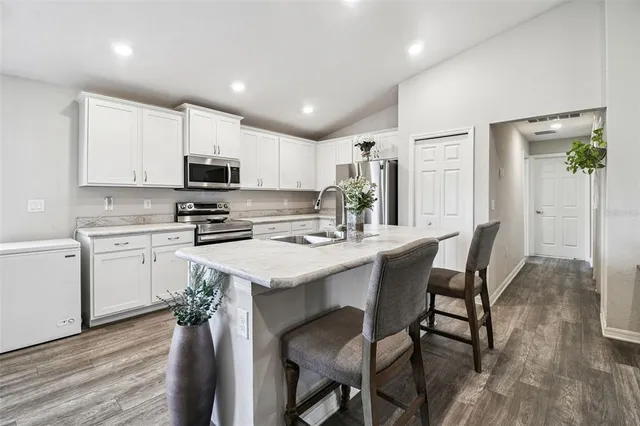 a spacious bathroom with a double vanity sink mirror and shower