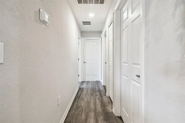 a bedroom with a bed and a television