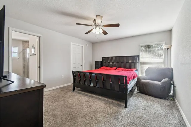 a bedroom with a bed and a bookshelf