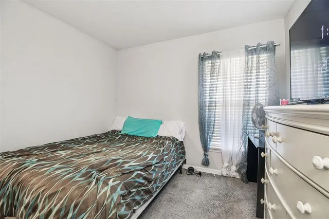an aerial view of a house with a swimming pool
