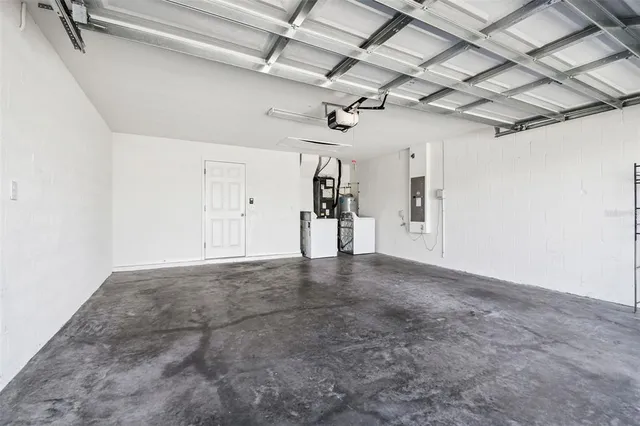 a view of a house with swimming pool and sitting area