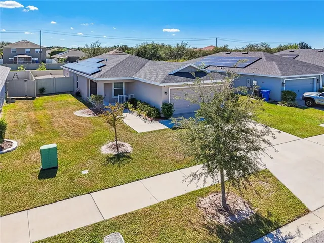 a view of swimming pool with outdoor seating and barbeque in the back