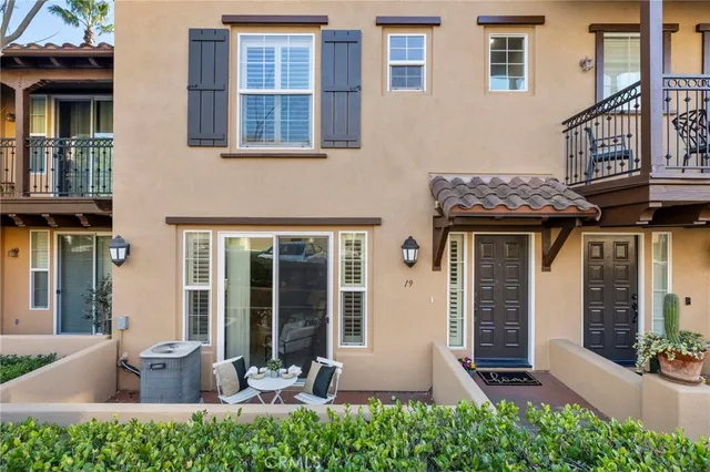 a view of a swimming pool with a lawn chairs next to a road